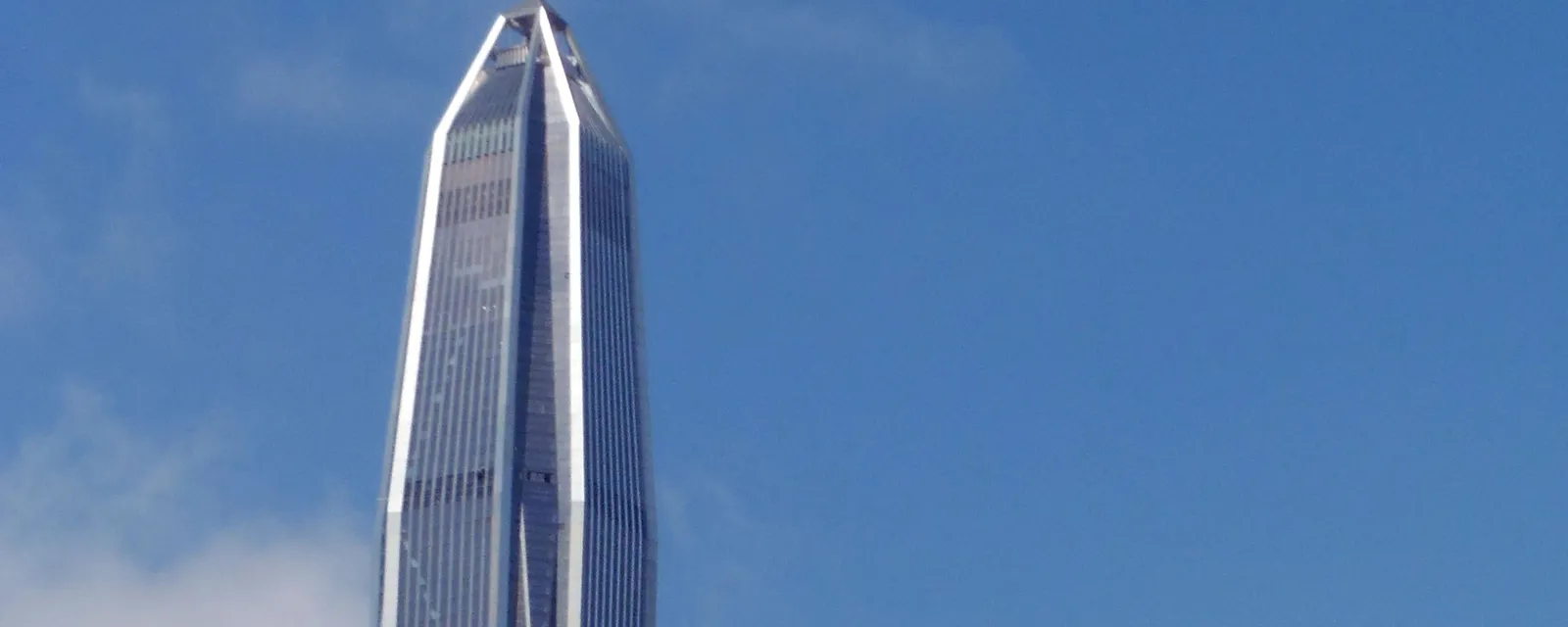 Ping An Finance Centre, the tapered supertall tower in Futian, rising into a blue sky